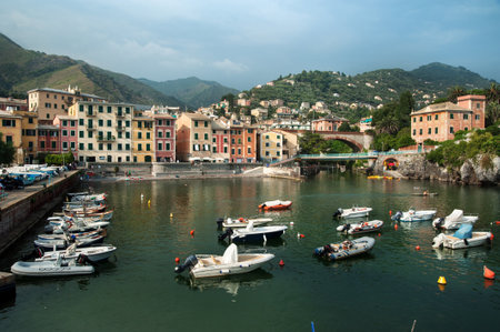 View of the bay with fishing boats and colorful houses of the coastal town of Nervi, Liguria, Genoa, Italy, Europeの写真素材