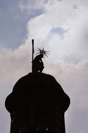 silhouette of a sitting figure against the sky, dome of the Boim Chapel in Lviv, Ukraineの写真素材