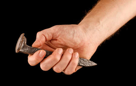 railway crutch in hand on a black isolate background