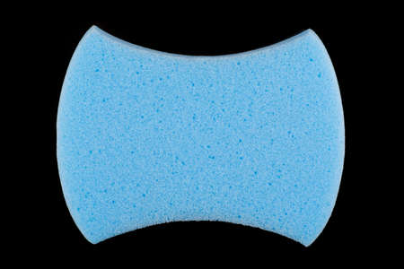 Blue sponge on black background close-up isolateの写真素材