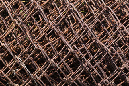 Rusty metal mesh twisted close-upの写真素材
