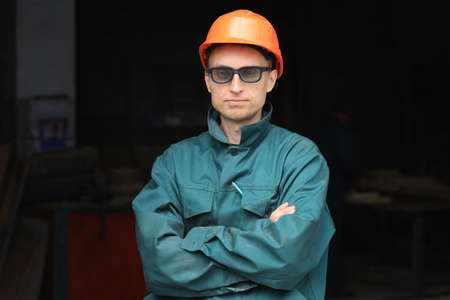 Young worker in glasses and respiratorの写真素材