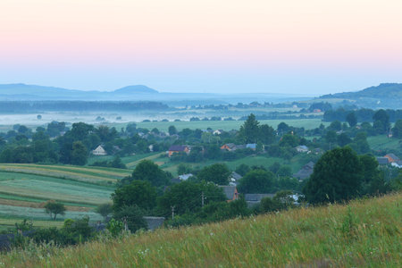 Ukrainian village Verkhobuzh in the morning in the fogの写真素材