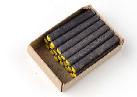Small firecrackers on a white background close-up