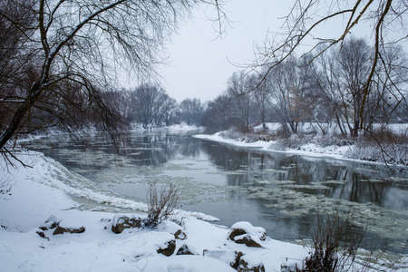 Beautiful cold river Dniester and snow winter landscapeの写真素材