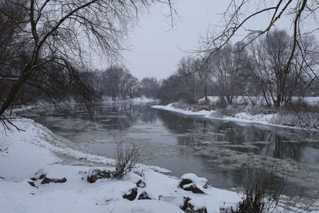 Beautiful winter landscape and cold river with snowの写真素材