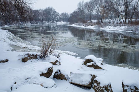 Beautiful cold river Dniester and snow winter landscape