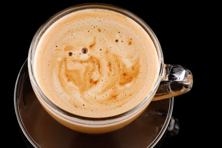 Cappuccino in a transparent cup with foamの写真素材