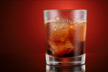 Soft drink with ice in a glass place for text cope spaceの写真素材