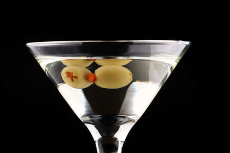 Green olives in a martini glassの写真素材