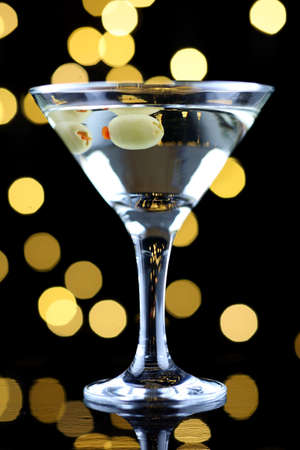 Green olives in a martini glassの写真素材