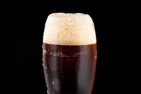 Beer in a glass on a dark backgroundの写真素材