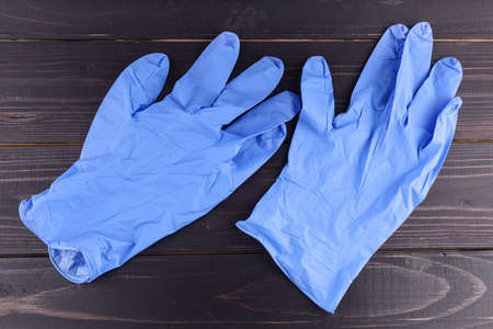 Medical gloves new blue dark backgroundの写真素材