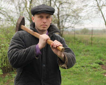 Worker with hammer in handsの写真素材