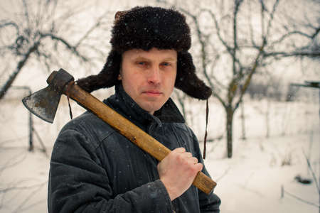 A peasant with an ax in winterの写真素材