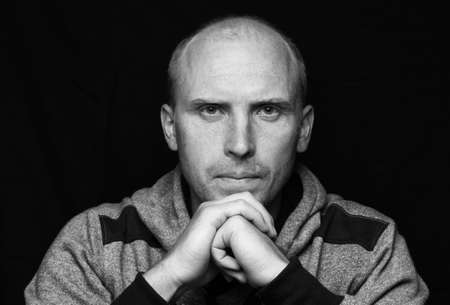 Bald young man looking and portrait in bwの写真素材