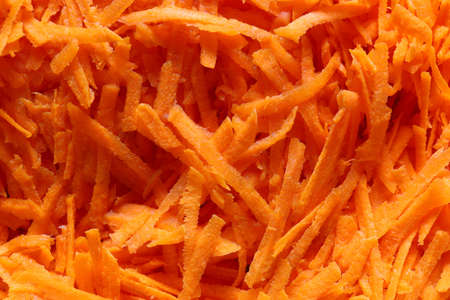 Sliced grated carrot for salad closeupの写真素材