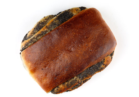Bun with poppy seeds and muffins on a white backgroundの写真素材