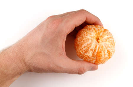 Peeled tangerine in hand isolate on a white backgroundの写真素材