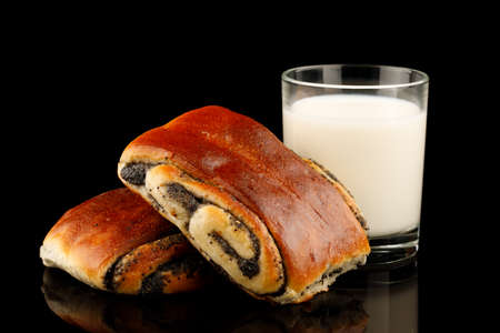 Bun with poppy seeds and muffins with milkの写真素材