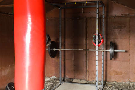 Home gym in garage and boxing bagの写真素材