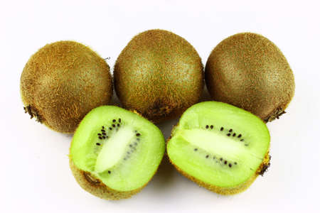 Several kiwi fruits on a white backgroundの写真素材