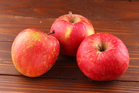 Red apple Fuji grade on the wooden backgroundの写真素材