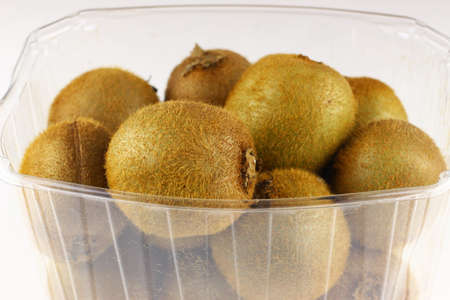 Basket of kiwi fruit on a white backgroundの写真素材