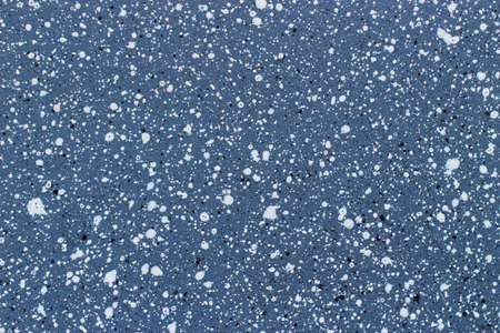 The surface of the pan is black with a splashの写真素材