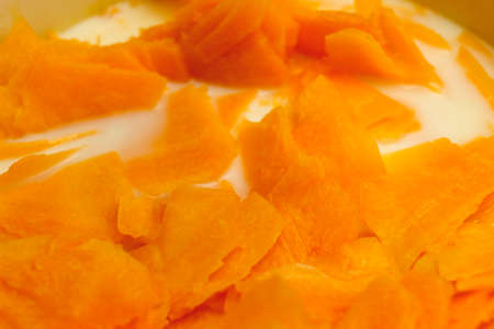 Pumpkin porridge cooking in a pan closeupの写真素材