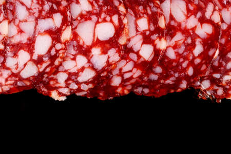 Red sausage on black background place for text cope spaceの写真素材