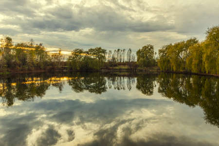 Beautiful lake during sunset and reflectionの写真素材
