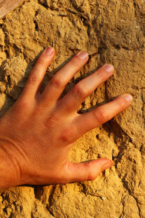 Man hand on wall closeupの写真素材