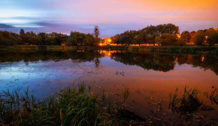 Beautiful city lake after sunsetの写真素材