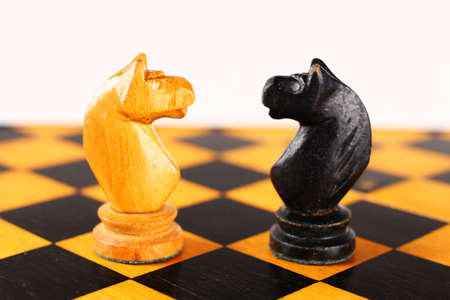 Chess black horse opposite whiteの写真素材