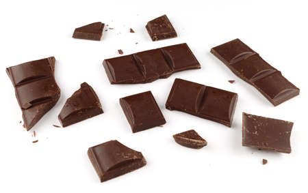 Pieces of dark chocolate on a white background isolateの写真素材