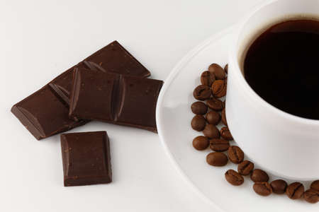 Coffee cup and chocolate on a white background isolateの写真素材