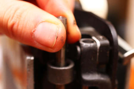 The master repairs the mechanism of mastering closeupの写真素材