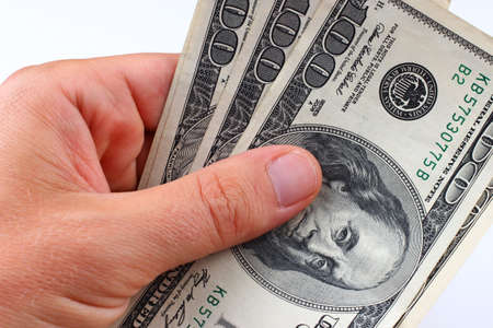 American money 100 dollars in hand close-up