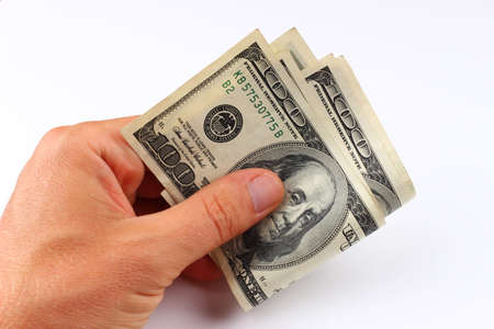 American money 100 dollars in hand close-upの写真素材