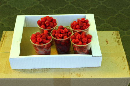 Sale of raspberries in the marketの写真素材