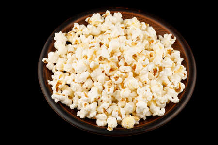 Delicious popcorn corn snack in a plate close-upの写真素材