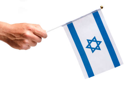Israel flag small in hand isolate.の写真素材