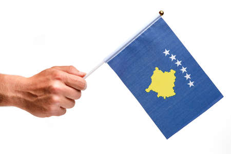 Kosovo flag small in hand isolate.の写真素材