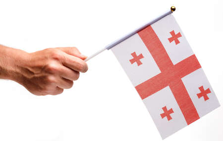Georgia flag small in hand isolate.の写真素材