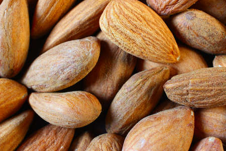 Lots of almonds. Delicious and healthy nut close-up.
