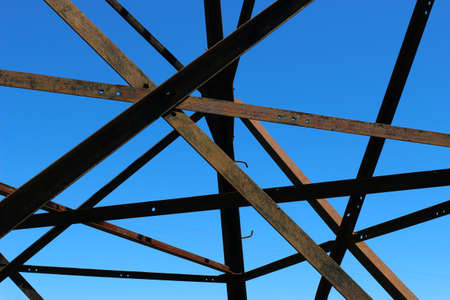 Power line pylon close-up. Metal construction.の写真素材