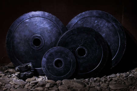 Sport barbell and pancakes in the gym.の写真素材