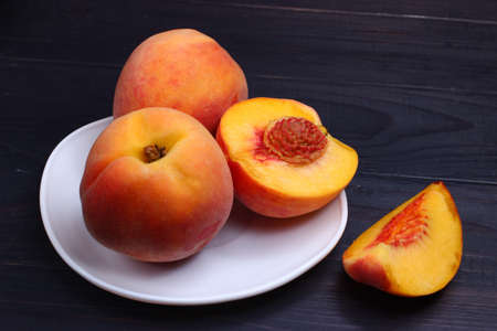 Peach cut on a plate. Exotic healthy fruit.の写真素材
