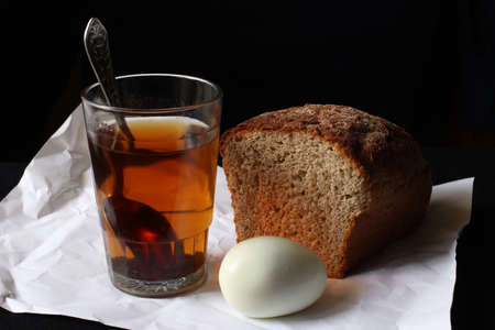Bread, egg and tea. Simple rustic food.の写真素材